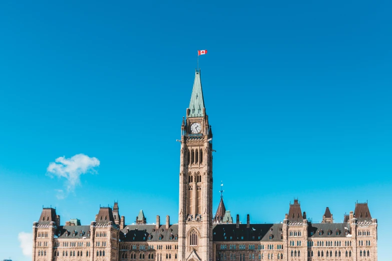 a large building with a clock tower on top of it, pexels contest winner, boards of canada, 🚿🗝📝, bright blue sky, parliament