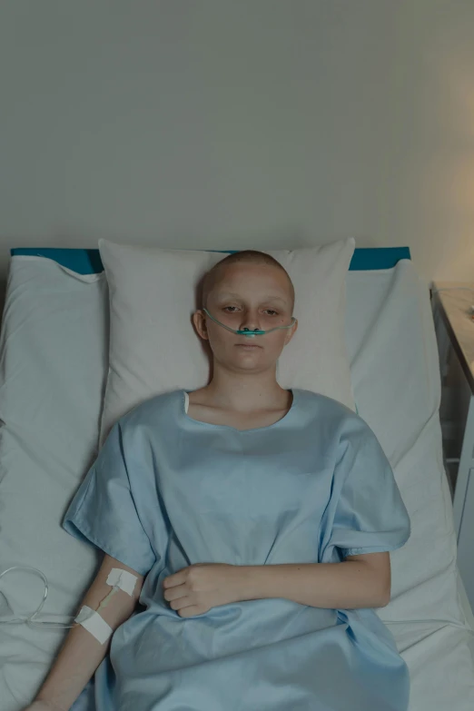 a woman in a hospital gown laying in a hospital bed, pexels contest winner, happening, greta thunberg, shaved head, ( ( theatrical ) ), still image from tv series