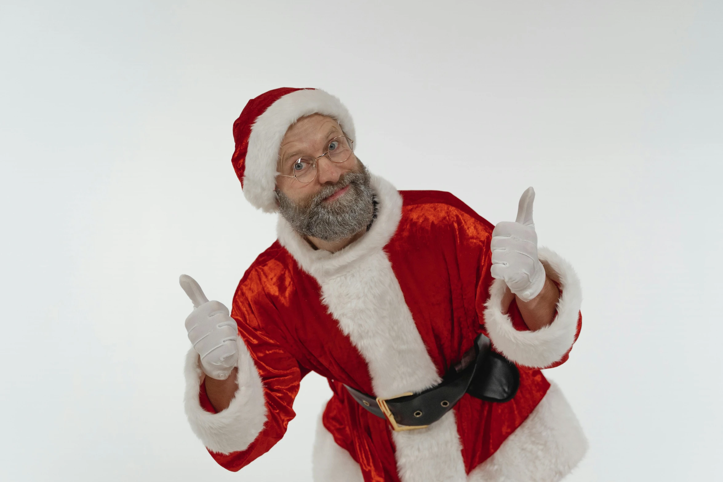 a man in a santa suit posing for a picture, a photo, by Matthias Stom, pexels, hurufiyya, thumb up, gray beard, avatar image, 90s photo