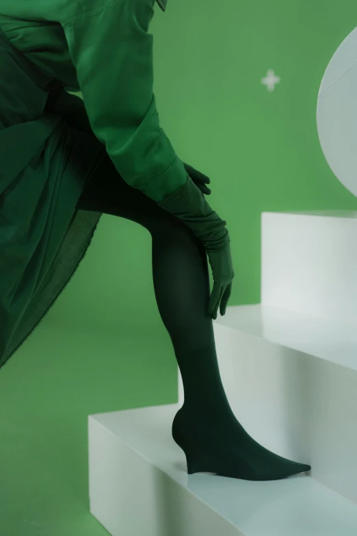 a woman that is standing on some steps, inspired by Art Green, renaissance, nylon tights, ambient green light, soft render, sustainable materials