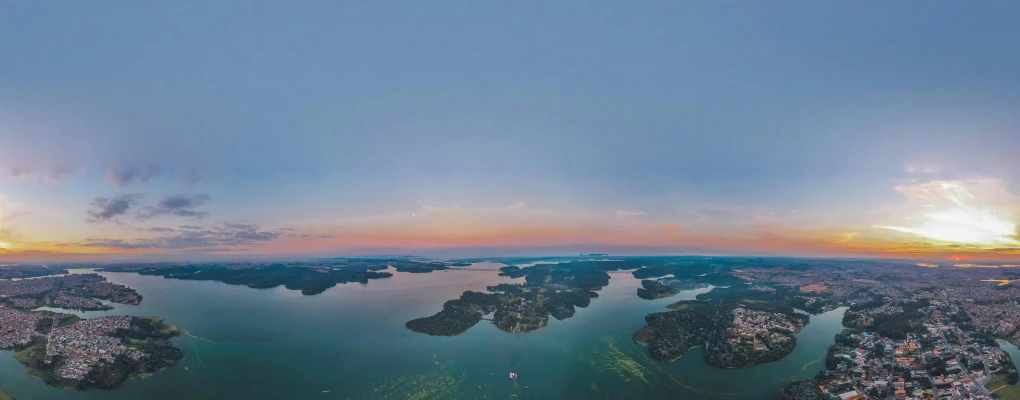 a panoramic view of a large body of water, pexels contest winner, flying islands, summer evening, air shot, color corrected