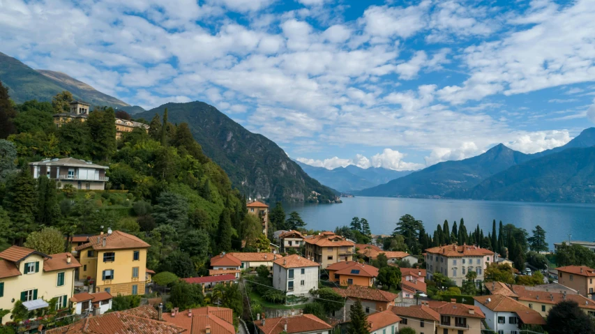 a group of houses sitting on top of a lush green hillside, inspired by Raffeaello Ossola, pexels contest winner, renaissance, lakeside mountains, avatar image, conde nast traveler photo, city views