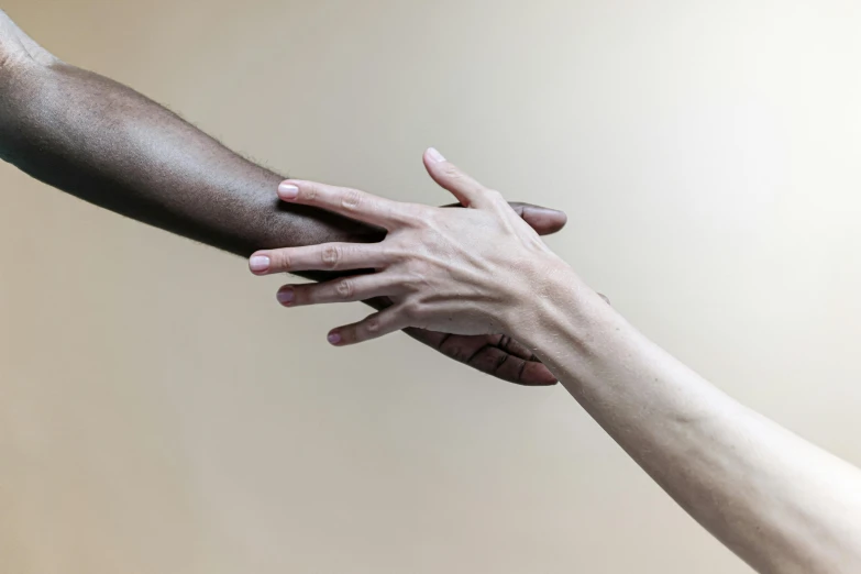 a close up of two hands reaching for each other, by Arabella Rankin, unsplash, visual art, gradient brown to white, black bandage on arms, varying ethnicities, portrait of two people