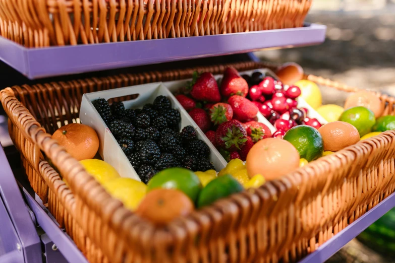 a wicker basket filled with assorted fruits and vegetables, purple colour scheme, al fresco, fruit machines, up close