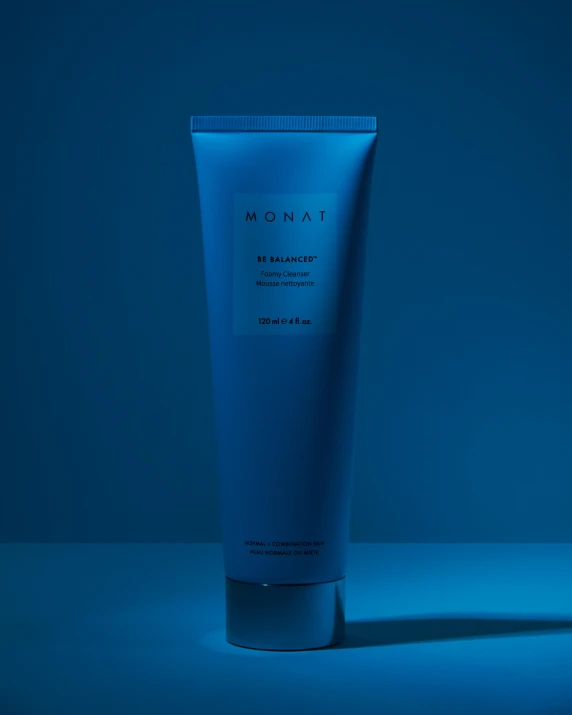a tube of moist cream against a blue background, by Nōami, behance contest winner, close full body shot, blue bioluminescent plastics, product image, be not afraid