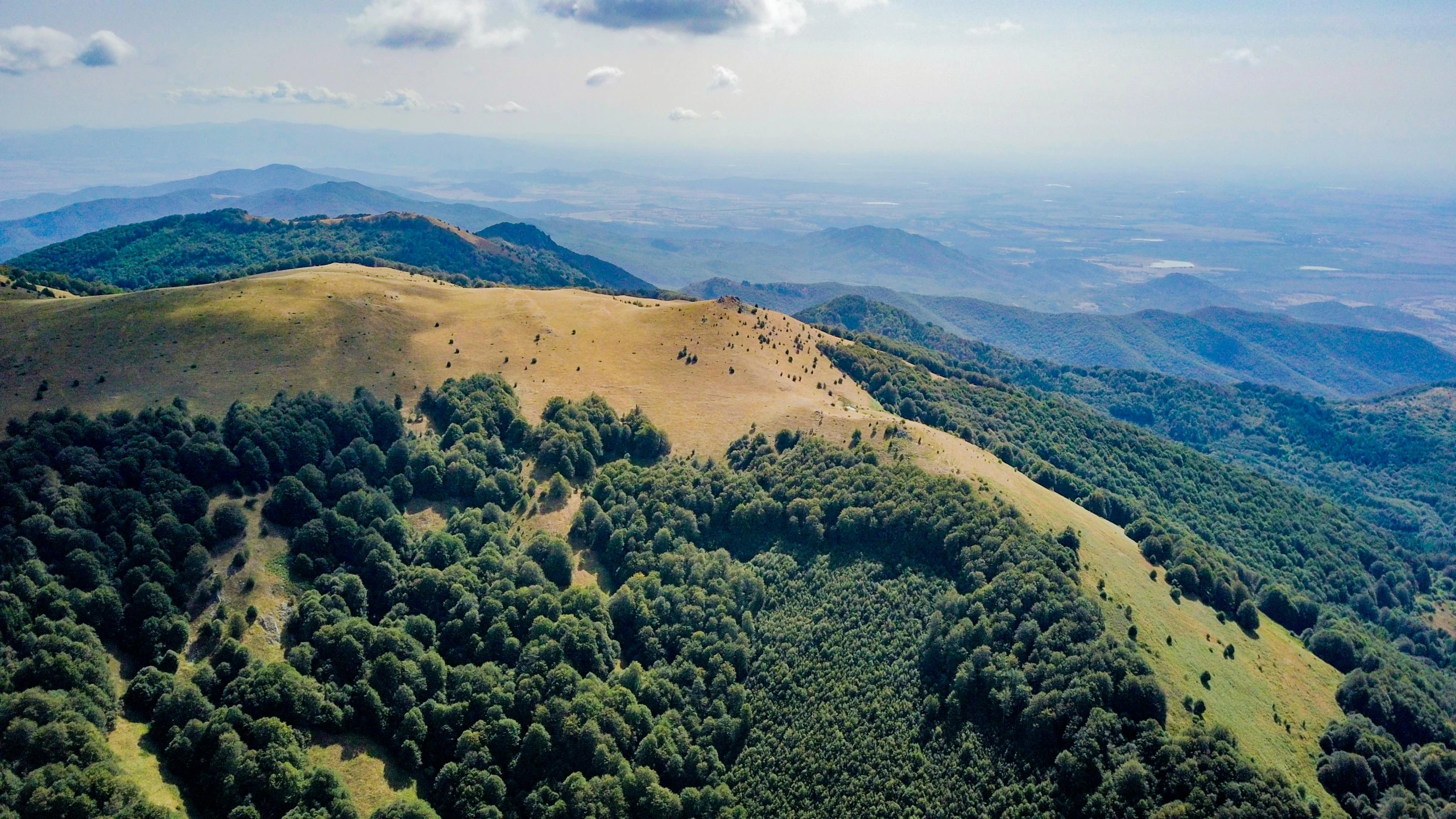 a view of the mountains from the top of a hill, by Adam Marczyński, pexels contest winner, les nabis, 2 5 6 x 2 5 6 pixels, tuscany hills, trekking in a forest, yann arthus - bertrand