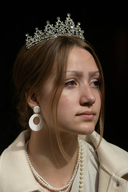 a close up of a person wearing a tiara, inspired by Barthélemy d'Eyck, portrait sophie mudd, concerned expression, long earrings, traditional russia