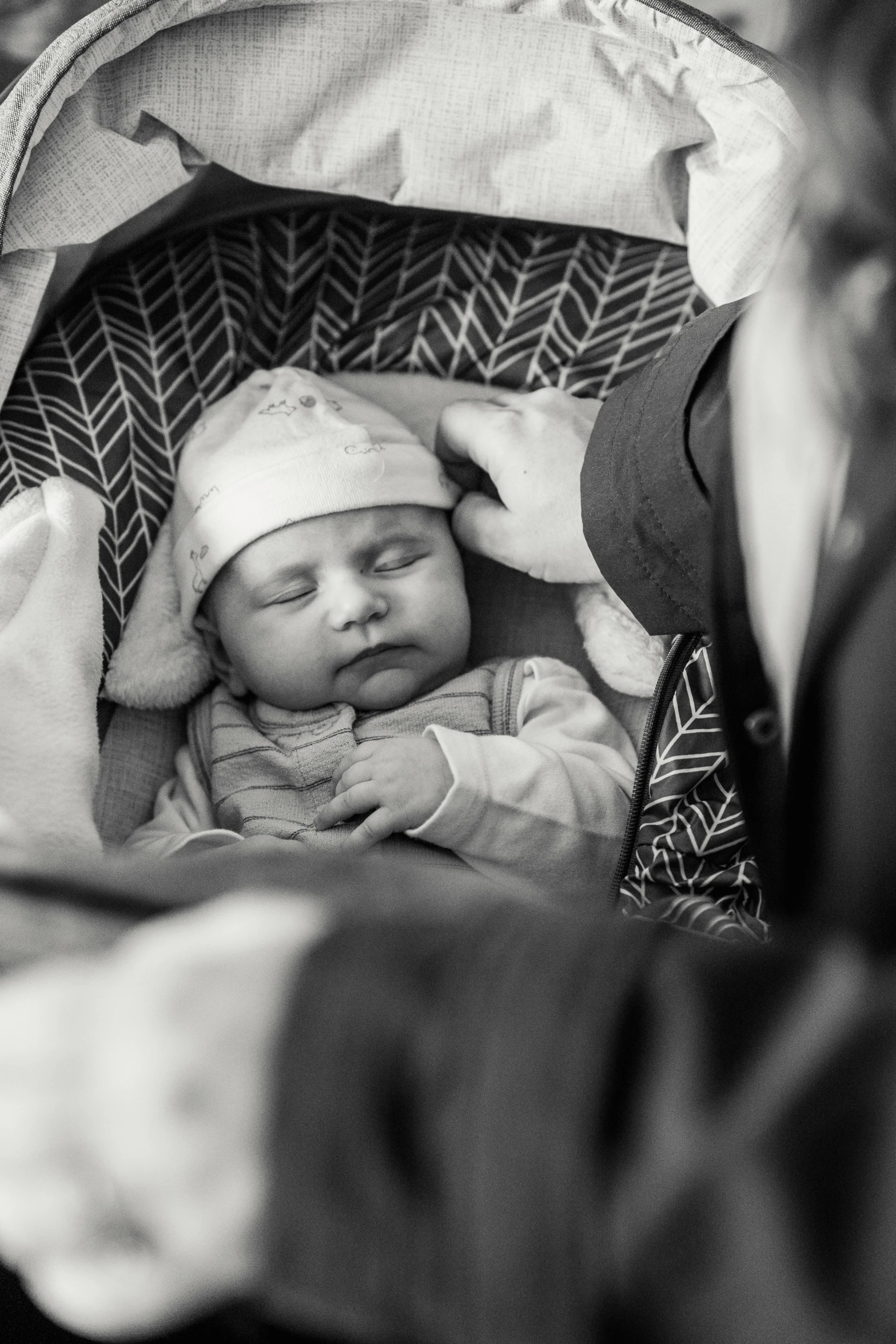 a black and white photo of a baby in a stroller, by Romain brook, pexels, sleepy, patterned, father, beautiful girl