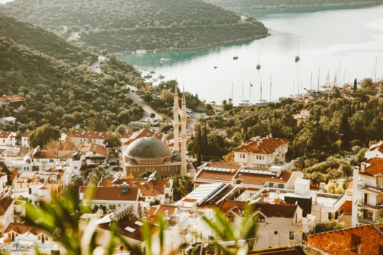 a view of a town from the top of a hill, pexels contest winner, hurufiyya, intricate copper details, mediterranean island scenery, 90s photo, with beautiful mosques