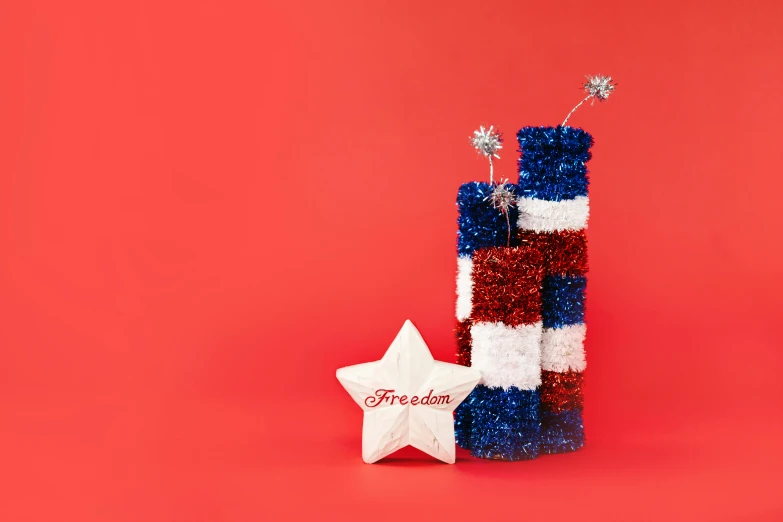 a red, white and blue bottle and a star on a red background, by Julia Pishtar, trending on unsplash, tissue ornament, liberty curls, high resolution product photo, made of wire