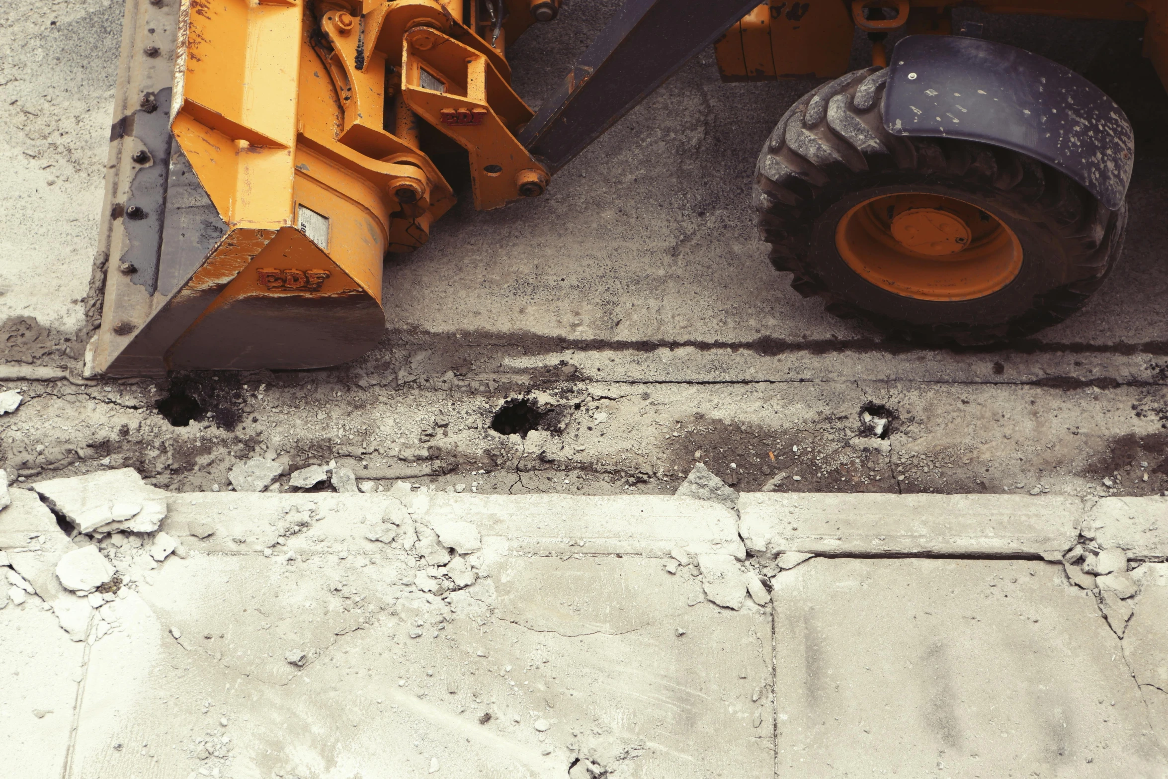 a bulldozer sitting on the side of a road, by Lee Loughridge, unsplash, constructivism, closeup photograph, saws, background image, high quality product image”