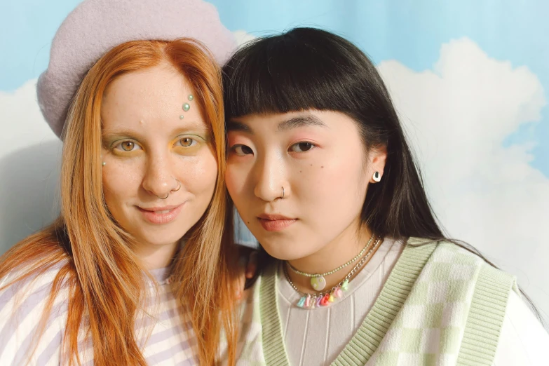 a couple of women standing next to each other, inspired by Wang Duo, trending on pexels, kitsch movement, pastel makeup, ginger hair with freckles, ethnicity : japanese, whitebangs