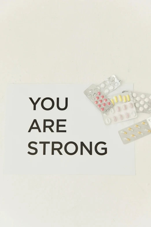 there is a sign that says you are strong, pexels, antipodeans, pills, y 2 k aesthetic, digital image, white ribbon