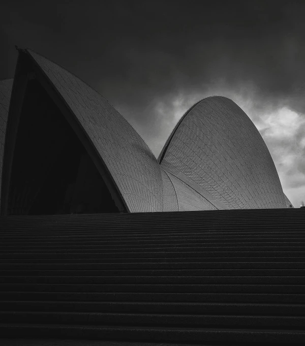 a black and white photo of the sydney opera, by Tobias Stimmer, australian tonalism, medium format. soft light, alessio albi, dark clouds, album