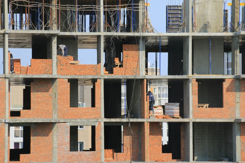 a group of people standing on top of a building under construction, inspired by Zhang Kechun, unsplash, constructivism, brick, ten flats, cg architects, seen from the side