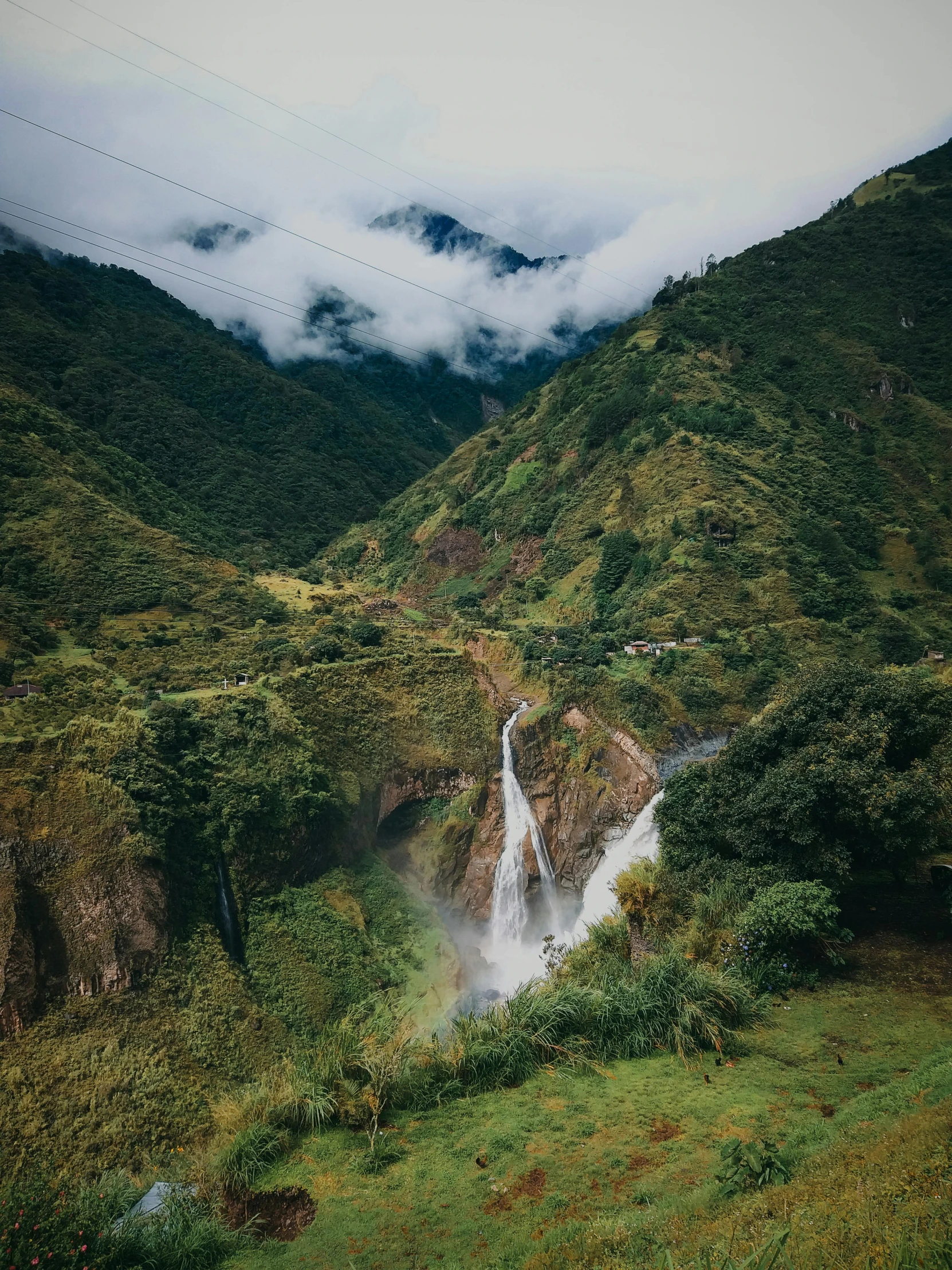 a waterfall in the middle of a lush green valley, by Alejandro Obregón, pexels contest winner, sumatraism, 2 5 6 x 2 5 6 pixels, low clouds after rain, thumbnail, high angle shot