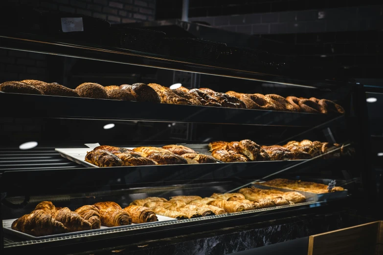 a display case filled with lots of baked goods, a portrait, unsplash, caulfield, profile image, fan favorite, woodfired