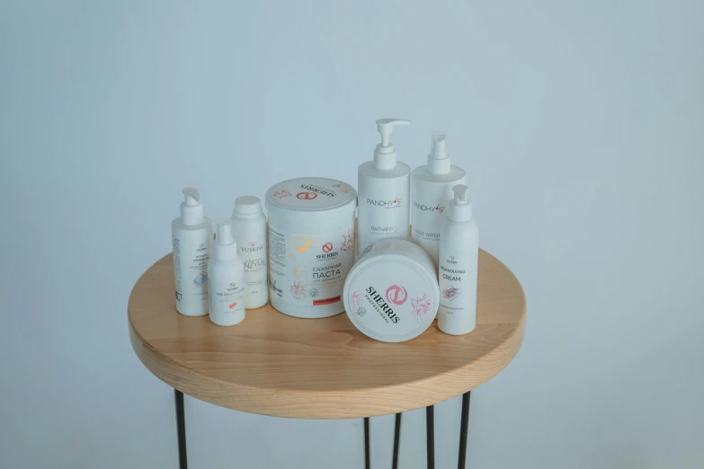 a table topped with lots of different types of skin care products, plasticien, sleek design, six arms, pregnancy, product view