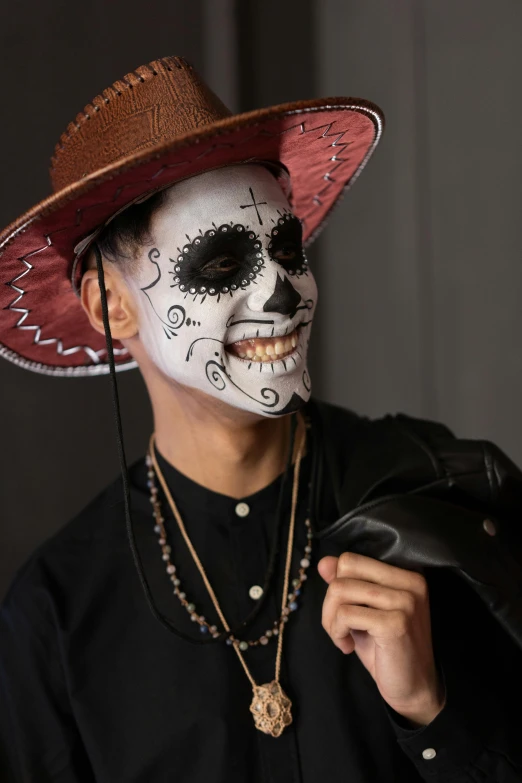 a man wearing a mexican day of the dead mask, an album cover, pexels contest winner, dark hat, ( ( dark skin ) ), teenage boy, religious