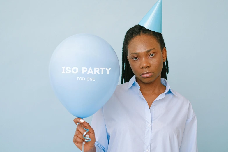 a woman in a party hat holding a blue balloon, an album cover, inspired by Jean-Étienne Liotard, trending on unsplash, health supporter, iq 4, intimidating pose, issey miyake