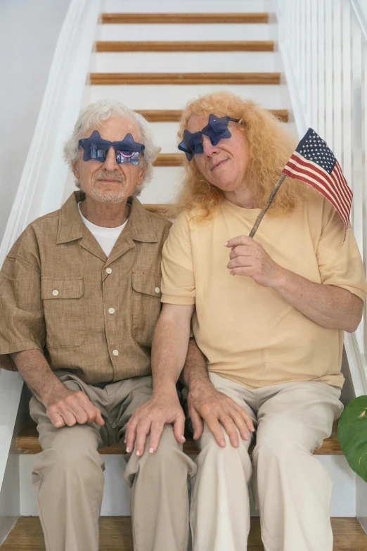 a couple of older men sitting next to each other, inspired by Stan and Jan Berenstain, trending on reddit, stars and stripes, goggle eyes, glamour shot, 4th of july