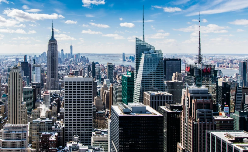 a view of a city from the top of a building, pexels contest winner, modernism, new york skyline, beautiful day, slide show, hi resolution