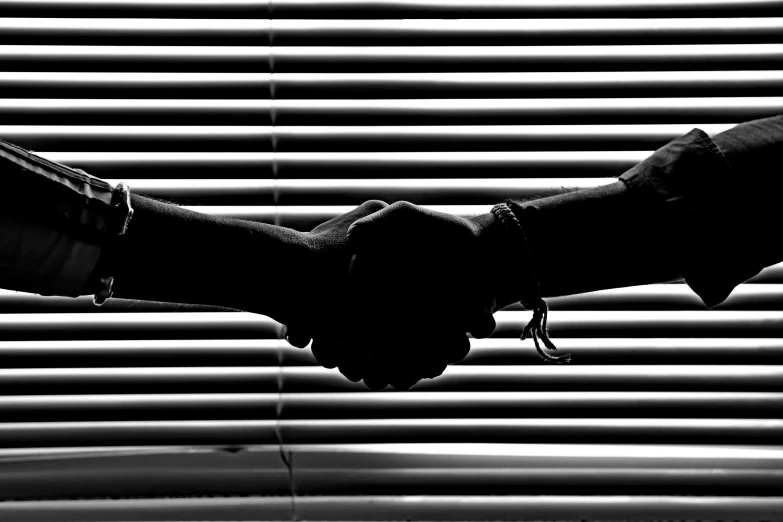 a black and white photo of two people shaking hands, a black and white photo, by Jan Rustem, purism, soft light through blinds, hd wallpaper, banner, merge