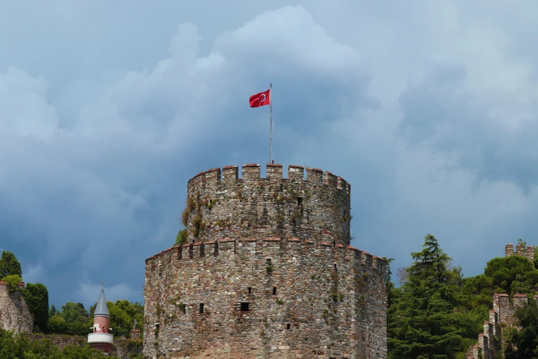 a castle with a flag on top of it, by Niyazi Selimoglu, pexels contest winner, renaissance, square, can basdogan, taken with sony alpha 9, sky blue