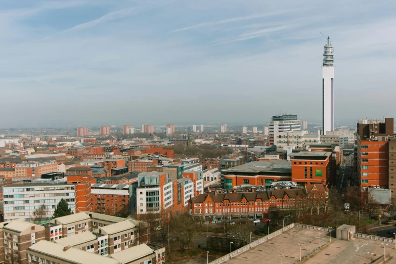 a view of a city from the top of a building, by Lee Loughridge, unsplash, coventry city centre, slide show, full body image