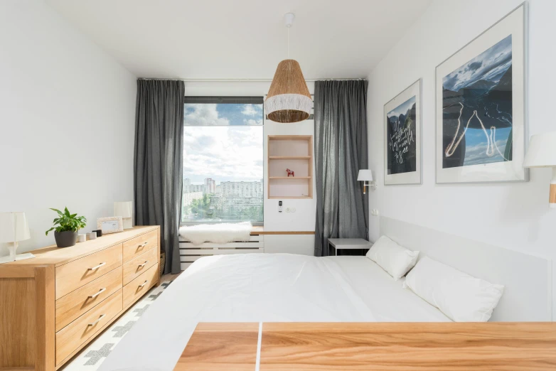 a white bed sitting in a bedroom next to a window, by Julia Pishtar, unsplash contest winner, light and space, wood cabinets, neo kyiv, panorama view, white background