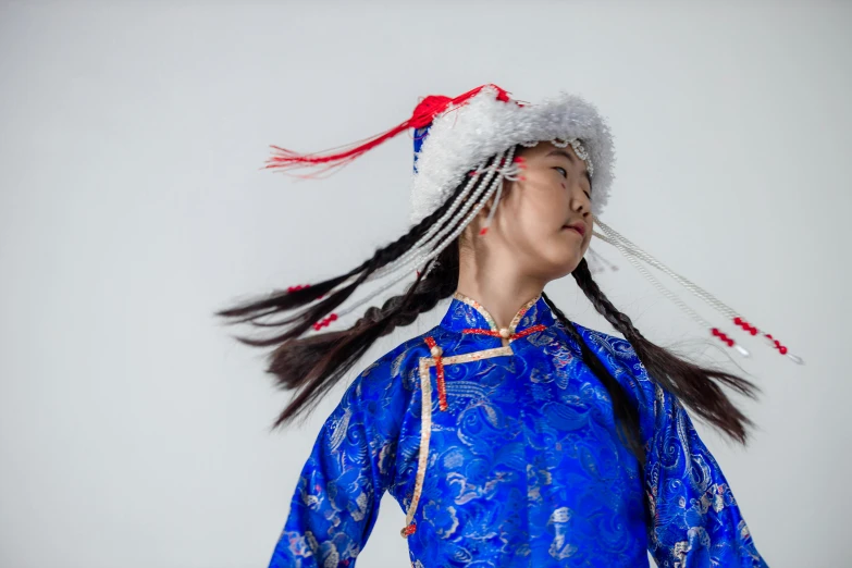 a woman wearing a blue dress and a red and white hat, an album cover, inspired by Guo Xi, trending on unsplash, cloisonnism, portrait of combat dancer, wearing festive clothing, young girl, pose 4 of 1 6