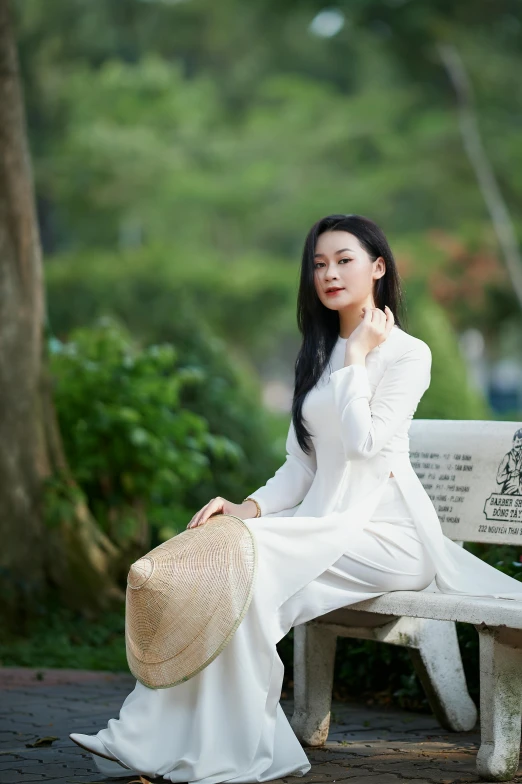 a woman sitting on a bench in a park, a picture, inspired by Cui Bai, white clothing, in style of lam manh, 15081959 21121991 01012000 4k, medium shot portrait