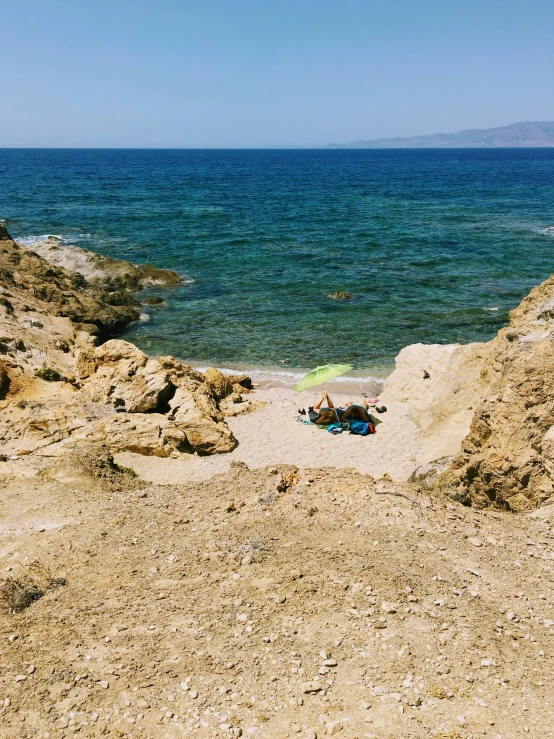 a couple of people laying on top of a sandy beach, by Alexis Grimou, les nabis, pathos, hidden area, profile image