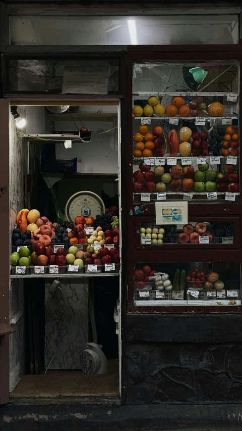 a store front filled with lots of fresh fruit, by Elsa Bleda, pexels, monia merlo, in doors, ap news photo, multiple stories