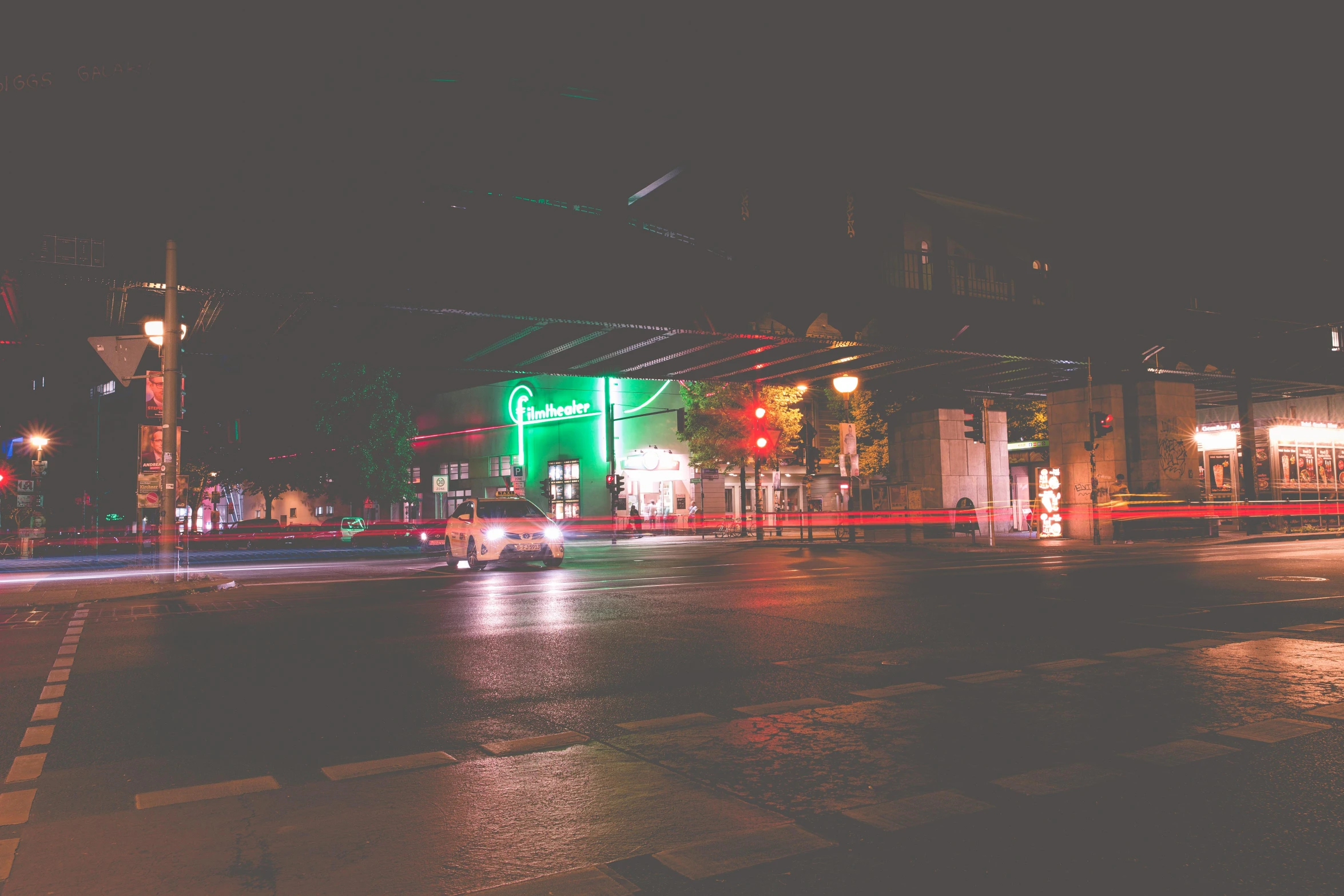 a city street filled with lots of traffic at night, trending on unsplash, realism, red and green tones, hannover, chicago, album cover