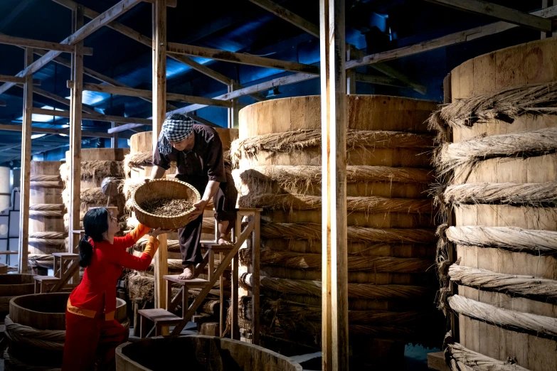 a little girl that is standing in front of some barrels, by Yasushi Sugiyama, pexels contest winner, process art, lots of jars and boxes of herbs, waterwheels, panoramic shot, preserved historical