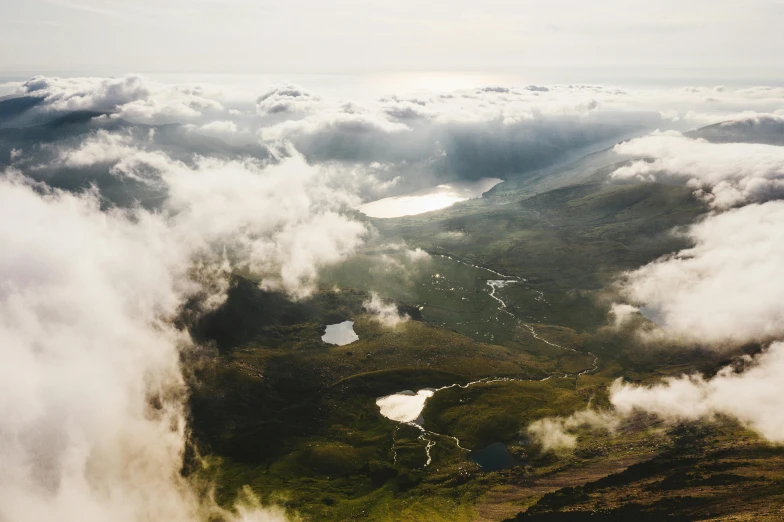 a group of people standing on top of a mountain, by Emma Andijewska, pexels contest winner, hurufiyya, floating lands in-clouds, view from above, scottish highlands, thumbnail