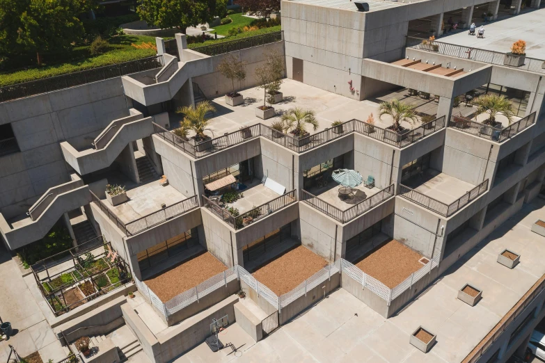 an aerial view of a building under construction, inspired by Tadao Ando, unsplash, brutalism, courtyard, chile, empty buildings with vegetation, 4 2 0