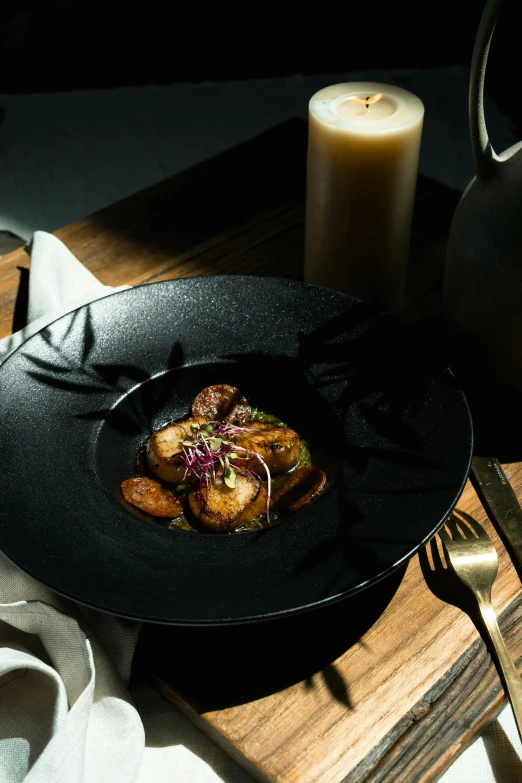 a close up of a plate of food on a table, inspired by Tomàs Barceló, dark setting, square, potato, umbra