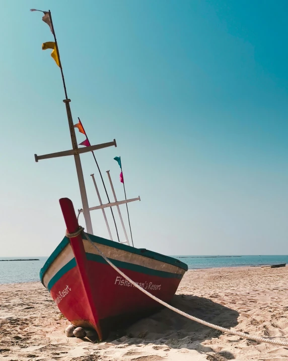 a red boat sitting on top of a sandy beach, lgbtq, thumbnail, sri lanka, multiple stories