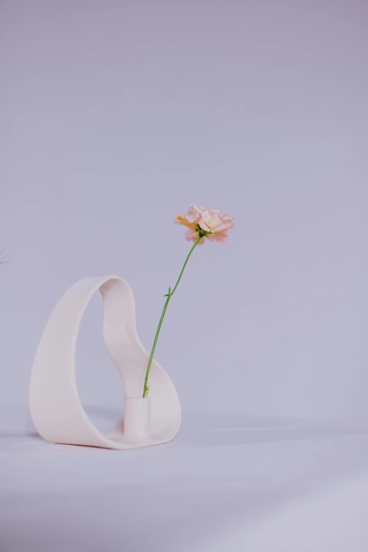 a white vase with a single flower in it, an abstract sculpture, unsplash, pastel', woamn is curved, medium long shot, ignant