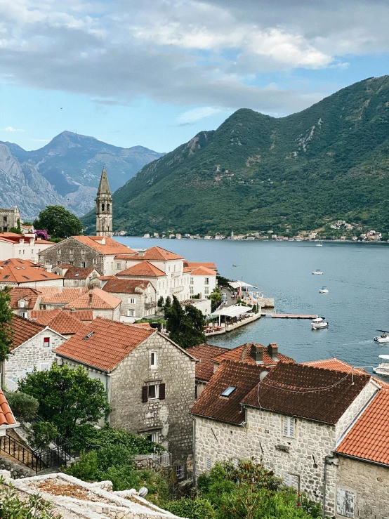 a view of a town next to a body of water, pexels contest winner, baroque, tiled roofs, boka, thumbnail, square