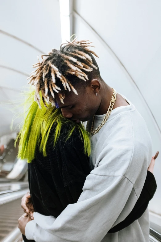 a man with green hair hugging a woman, trending on pexels, playboi carti, yellow spiky hair, cords, very emotional