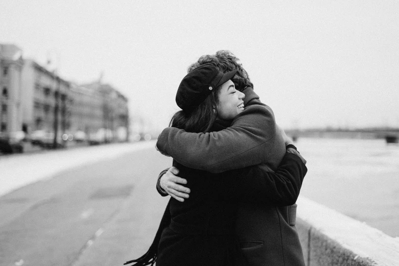 a black and white photo of two people hugging each other, a black and white photo, by Emma Andijewska, pexels, 🚿🗝📝, nikolay kopeykin, male and female, good friends