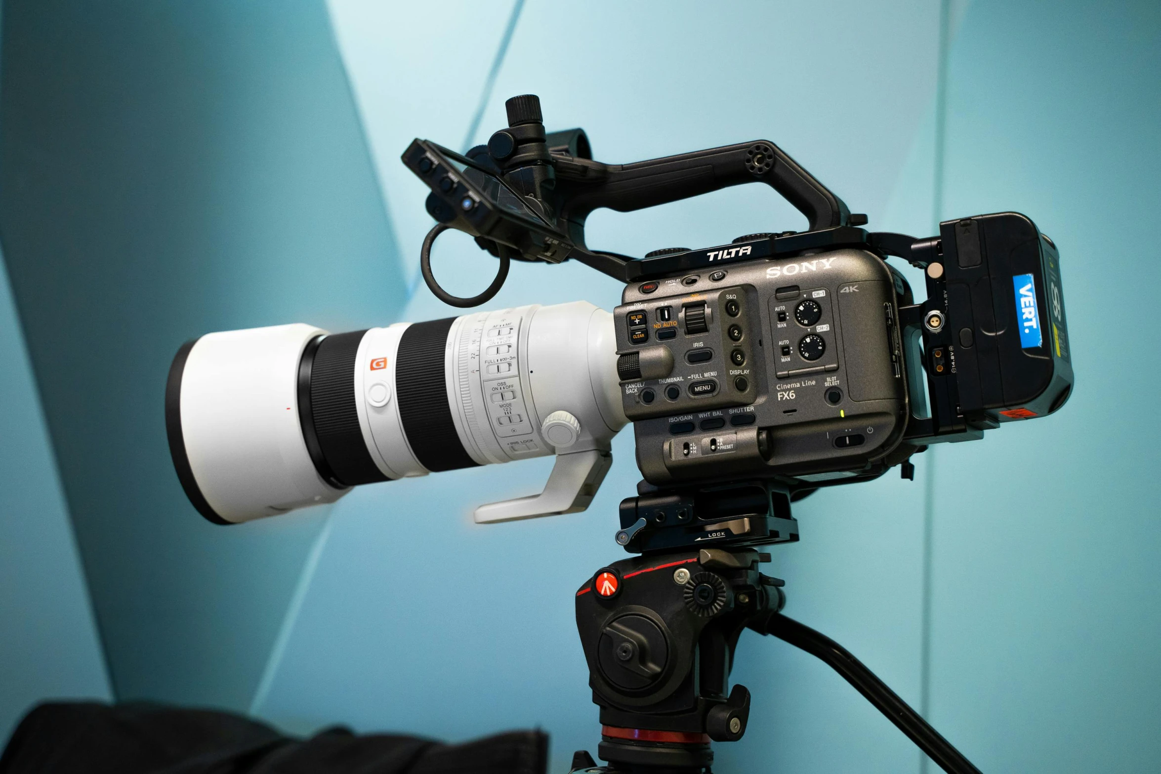 a close up of a camera on a tripod, sony fx 6, with anamorphic lenses, sony a 7 r 3