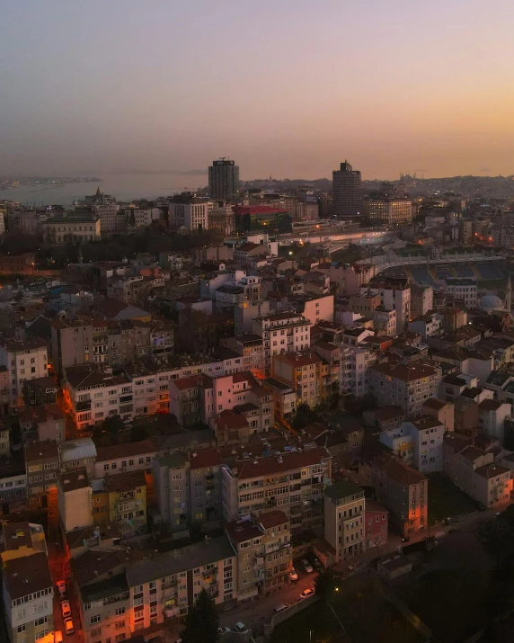 a bird's eye view of a city at sunset, an album cover, pexels contest winner, istanbul, fading rainbow light, low quality footage, gif