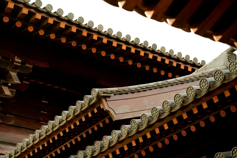 a clock that is on the side of a building, inspired by Itō Jakuchū, unsplash, shin hanga, tiled roofs, brown, wooden ceiling, high details photo