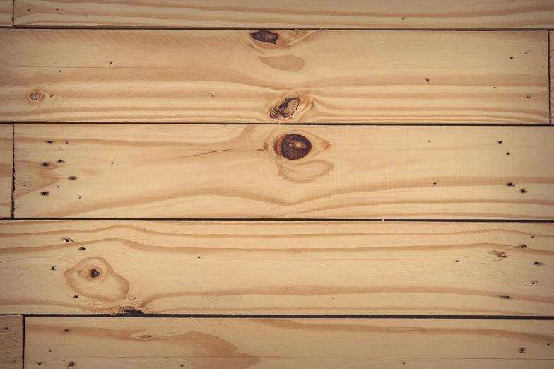 a pair of scissors sitting on top of a wooden table, an album cover, inspired by Donald Judd, unsplash, wood paneling, pine, full pallet image, light - brown wall