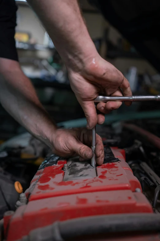 a mechanic working on a car engine, a portrait, by Thomas Furlong, pexels contest winner, auto-destructive art, holding a sword and a chisel, holding a battery, 2717433015, rectangle