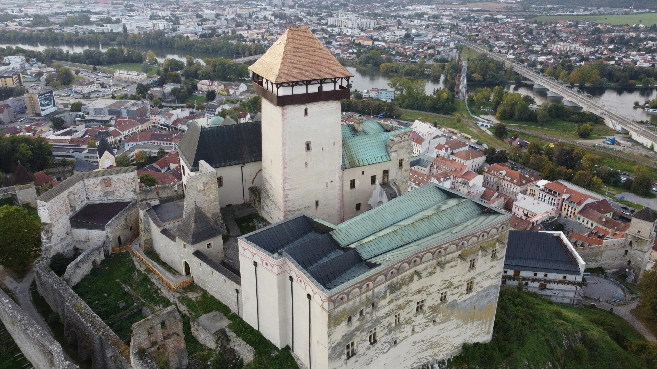 a large castle sitting on top of a lush green hillside, an album cover, by Emma Andijewska, pexels contest winner, birds - eye view, southern slav features, museum, dug stanat